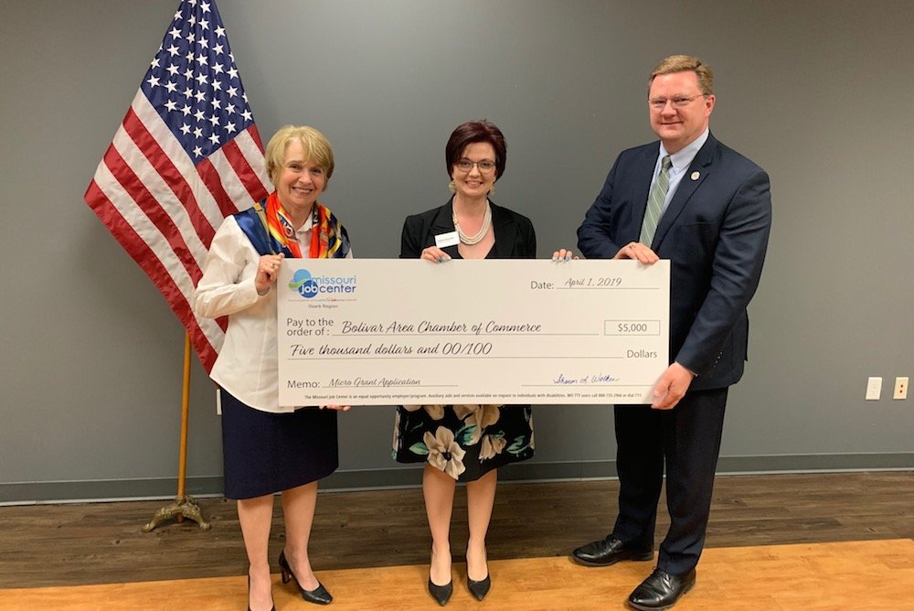 Bobbie McKnight, center, of the Bolivar Area Chamber of Commerce receives a $5,000 check from Sharon Walker, chair of the Ozark Region Workforce Development Board, and Greene County Presiding Commissioner Bob Dixon.
